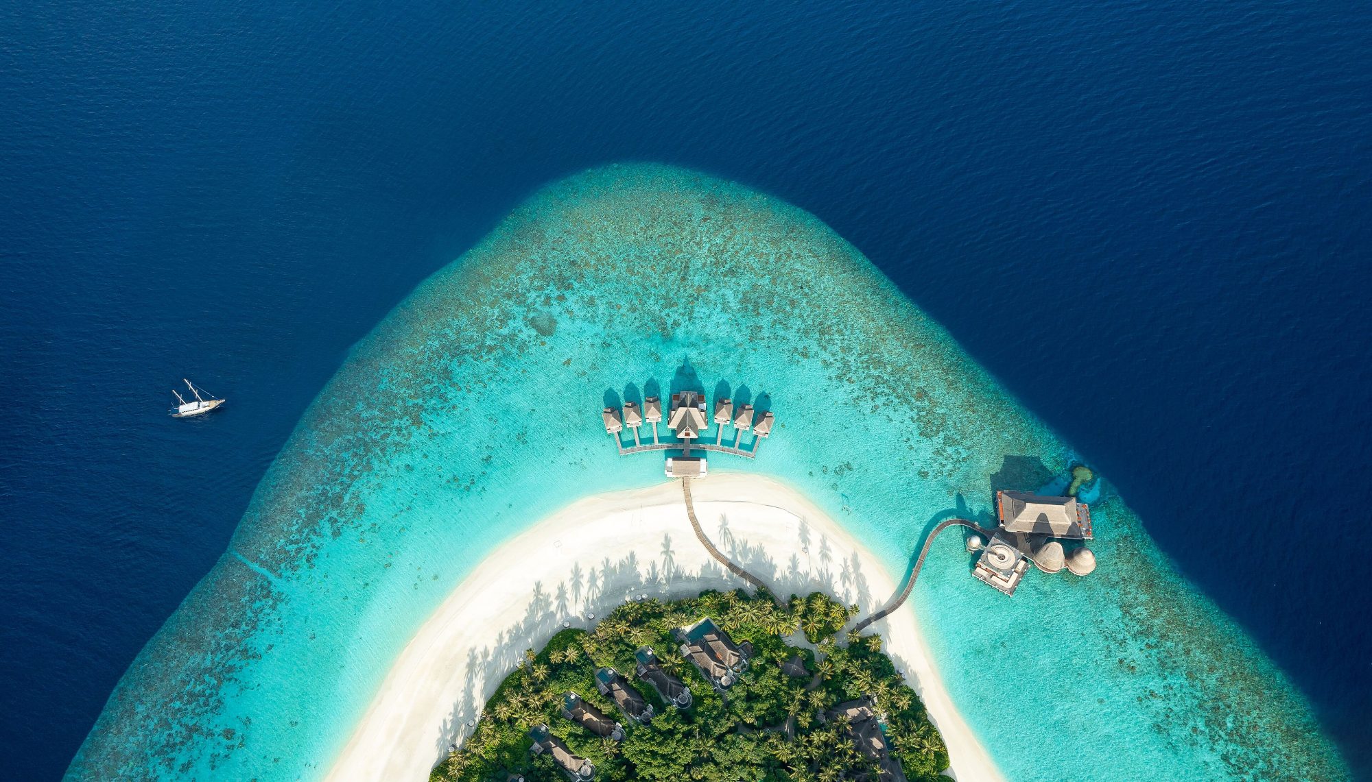 An island ringed by its reef in Baa Atoll, seen from the air